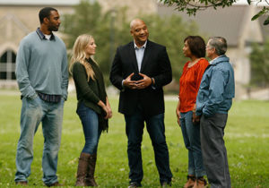 A group of people talking together